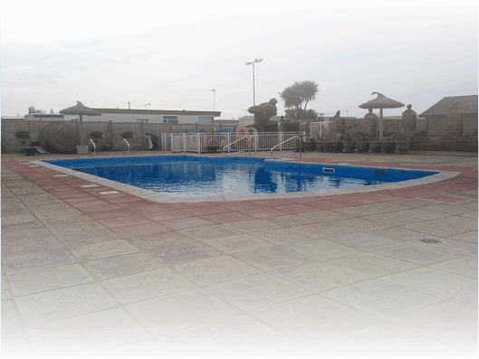 pool with glass building